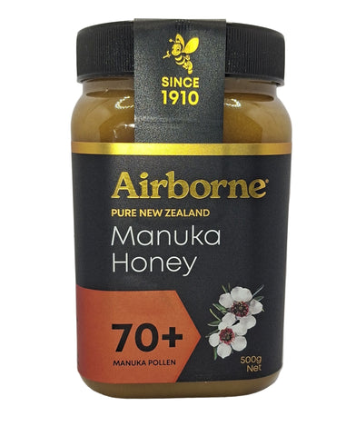 Airborne Manuka Honey jar with black lid on a white background